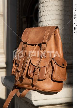 photo of a light brown, retro look leather backpack photo of a light brown, retro look leather backpack 99797269
