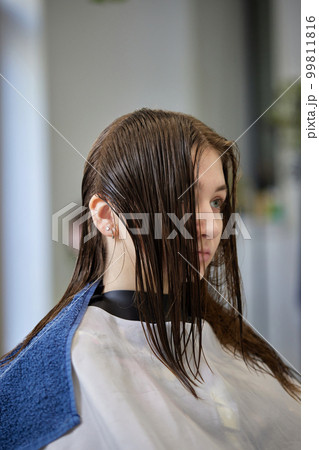 young girl gets fashionable haircut in modern salon young girl gets fashionable haircut in modern salon 99811816