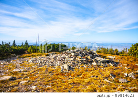 Small stone pyramid on the summit of Pec Mountain. Cold and sunny autumn day in Hruby Jesenik Mountains, Czech Republic 99814623