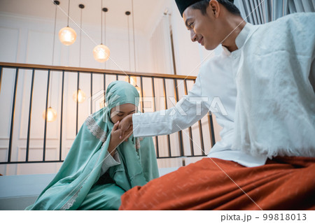 women kiss a man's hand as a sign of respect women kiss a man's hand as a sign of respect 99818013