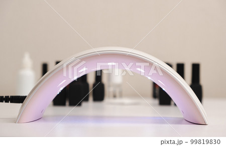 Ultraviolet LED lamp for drying gel nail polish and jars with gel polishes. Manicure and pedicure. Ultraviolet LED lamp for drying gel nail polish and jars with gel polishes. Manicure and pedicure. 99819830