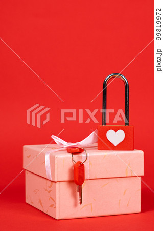 Valentine's Day Card - lock with keys on a gift box on a red background, a place for text Valentine's Day Card - lock with keys on a gift box on a red background, a place for text 99819972