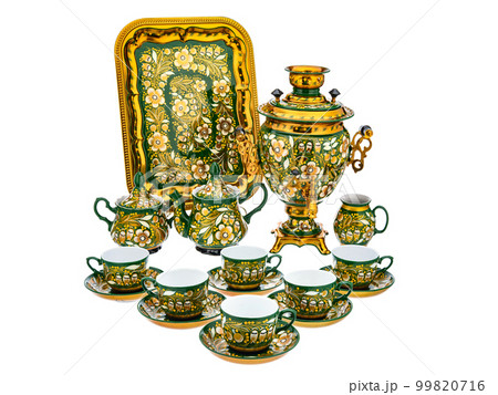 Tea Set of Old Traditional Russian folk utensils. Dishes with handmade painting floral ornament in style of Khokhloma isolated on white background. 99820716