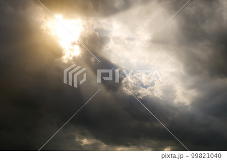 Sunbeams through storm clouds. 99821040
