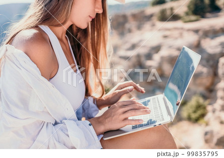 Woman sea laptop. Business woman in yellow hat freelancer with laptop working over blue sea beach. Girl relieves stress from work. Freelance, digital nomad, travel and holidays concept Woman sea laptop. Business woman in yellow hat freelancer with laptop working over blue sea beach. Girl relieves stress from work. Freelance, digital nomad, travel and holidays concept 99835795
