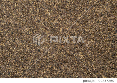 Poured ground black pepper background. Dry seasoning pepper. Spices and herbs for cooking, pepper powder Poured ground black pepper background. Dry seasoning pepper. Spices and herbs for cooking, pepper powder 99837860