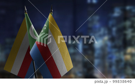 Small flags of the Comoros on an abstract blurry background 99838640