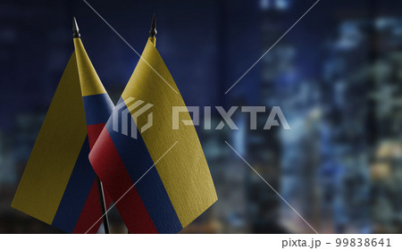 Small flags of the Colombia on an abstract blurry background 99838641