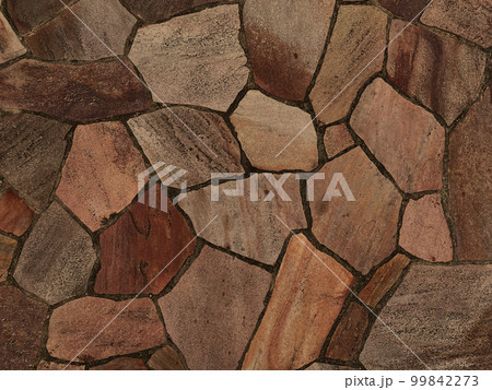 明るい茶色の乱張りした乱形の敷石の表面の背景画像 明るい茶色の乱張りした乱形の敷石の表面の背景画像 99842273