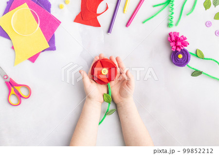 Handmade felt flowers craft with kids women's mother's day gift present hands Handmade felt flowers craft with kids women's mother's day gift present hands 99852212