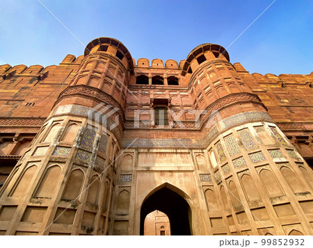 The famous red fort in the city of Agra, India. Tourists visit a popular tourist attraction. The famous red fort in the city of Agra, India. Tourists visit a popular tourist attraction. 99852932