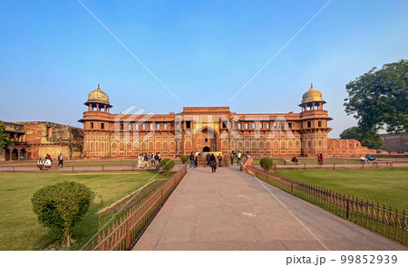 The famous red fort in the city of Agra, India. Tourists visit a popular tourist attraction. The famous red fort in the city of Agra, India. Tourists visit a popular tourist attraction. 99852939