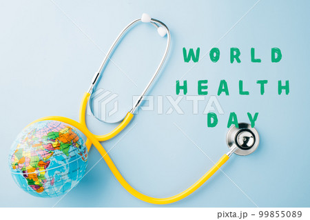World Health Day. Yellow doctor stethoscope and world globe isolated on blue background, Save world day, Green Earth, Healthcare and medical concept World Health Day. Yellow doctor stethoscope and world globe isolated on blue background, Save world day, Green Earth, Healthcare and medical concept 99855089