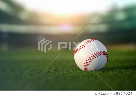 Baseball ball in a grass of baseball arena stadium. Baseball ball in a grass of baseball arena stadium. 99857024