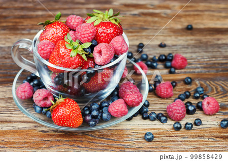 Mix of berries in a a transparent cup 99858429