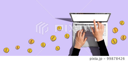 Person using a laptop with hand drawn coins Person using a laptop with hand drawn coins 99878426