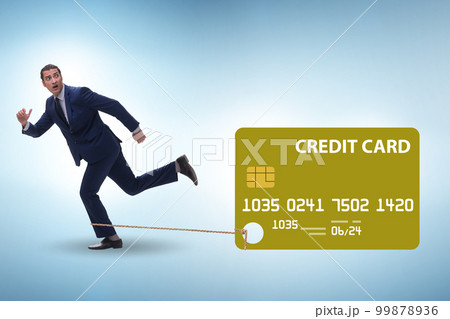 Businessman in the credit card debt concept Businessman in the credit card debt concept 99878936