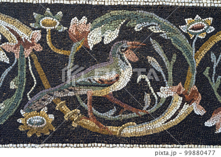 Roman mosaic tiles. Ruin of ancient roman floor art. 99880477