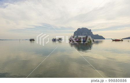 Beautiful sunset at Pak Meng Beach in Trang, Thailand. 99880886