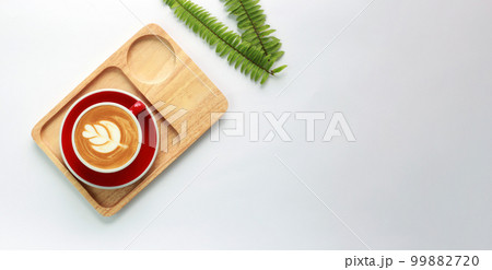 Coffee latte on a cup of white table. top view Coffee latte on a cup of white table. top view 99882720
