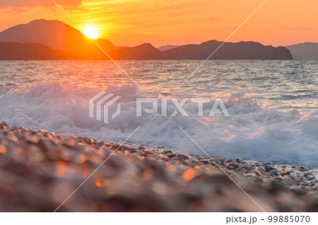 Sea coast with stones at sunrise. Beach of Black sea Sea coast with stones at sunrise. Beach of Black sea 99885070