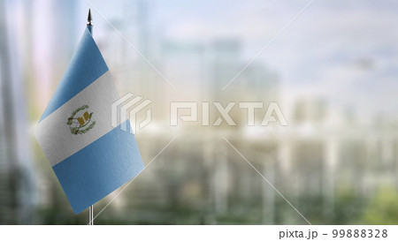 Small flags of the Guatemala on an abstract blurry background 99888328