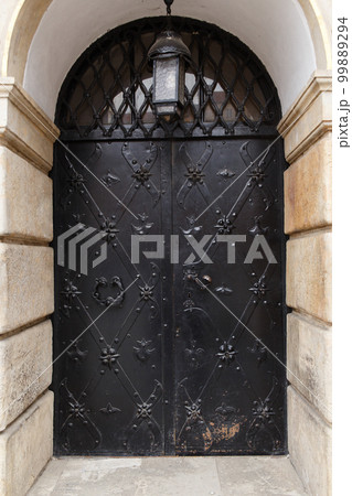 Old massive swinging metal forged doors Old massive swinging metal forged doors 99889294