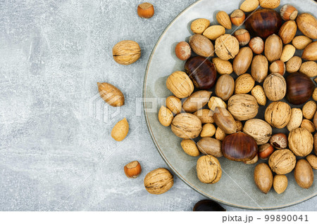 Assortment of nuts on a plate Assortment of nuts on a plate 99890041