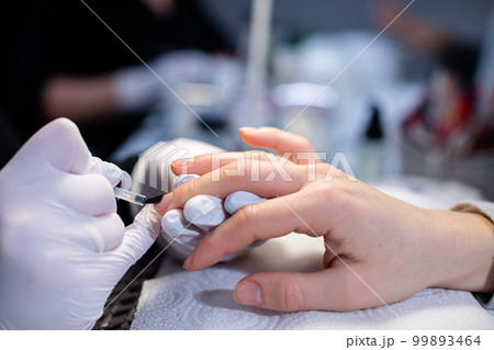 Close-up on the hands of a beauty salon client. Close-up on the hands of a beauty salon client. 99893464