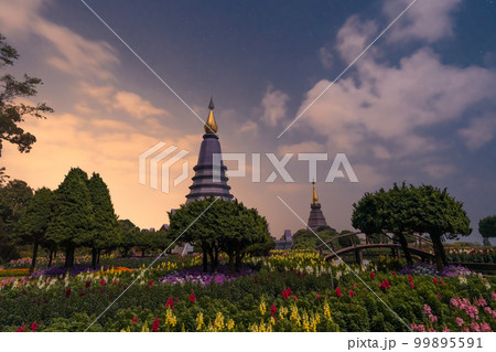 Night sky time lapse of moving Milky Way and stars under moon light at Phra Mahathat monuments on Doi Inthanon 99895591