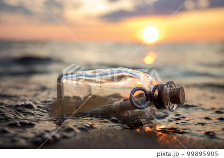 Message in the bottle against the Sun setting down Message in the bottle against the Sun setting down 99895905