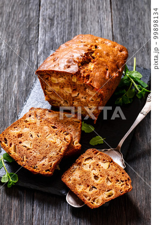 apple cinnamon bread on slate board, top view 99898134