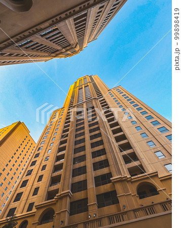 Dubai Marina, harbour, cruise boat and canal promenade view at sunset, in Dubai, United Arab Dubai Marina, harbour, cruise boat and canal promenade view at sunset, in Dubai, United Arab 99898419
