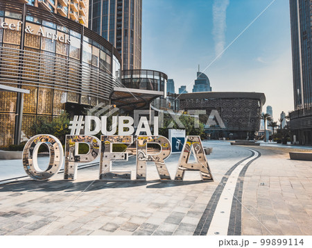 Dubai Opera house Sign in Downtown Dubai, surrounded by skyscrapers and Burj Khalifa, in UAE, United 99899114