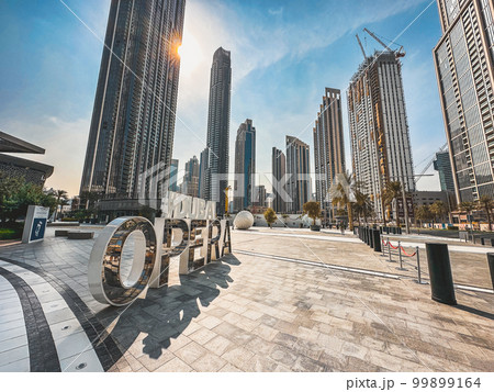 Dubai Opera house Sign in Downtown Dubai, surrounded by skyscrapers and Burj Khalifa, in UAE, United 99899164