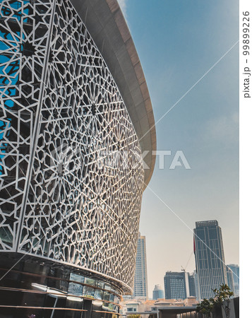 Dubai Opera house in Downtown Dubai, surrounded by skyscrapers and Burj Khalifa, in UAE, United Arab Dubai Opera house in Downtown Dubai, surrounded by skyscrapers and Burj Khalifa, in UAE, United Arab 99899226