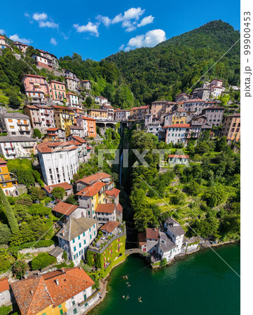 Aerial view of Nesso, a picturesque and colourful village sitting on the banks of Lake Como, Italy Aerial view of Nesso, a picturesque and colourful village sitting on the banks of Lake Como, Italy 99900453
