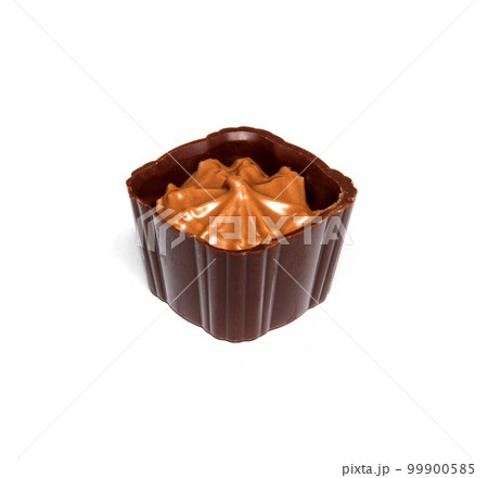 Chocolate candy with cream on a white isolated background. Idea for dessert in a restaurant Chocolate candy with cream on a white isolated background. Idea for dessert in a restaurant 99900585