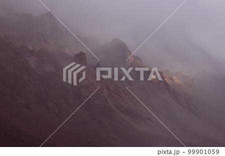 Snow storm in the mountains haze wind snow falling. Parque provincial Aconcagua, Mendoza Argentina 99901059