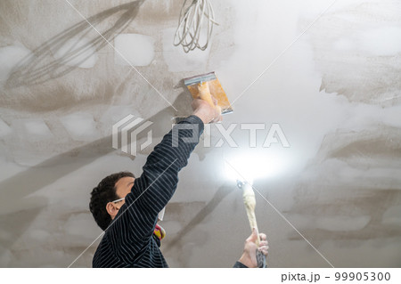hand sanding of the plasterboard ceiling with a trowel hand sanding of the plasterboard ceiling with a trowel 99905300