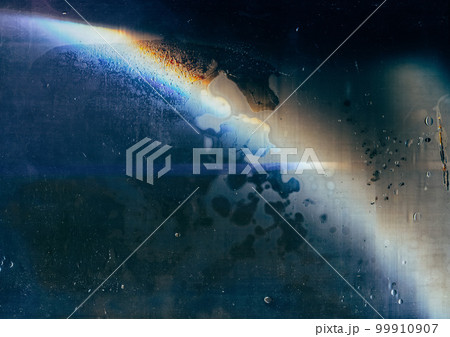 Weathered glass. Dust scratches. Old film overlay. Orange blue rainbow flare noise dirt stains water drops on dark wet aged window texture abstract illustration background. 99910907