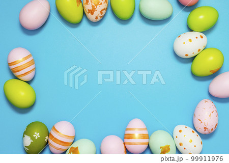 Easter Eggs. Colorful Easter eggs on blue background with copy space 99911976