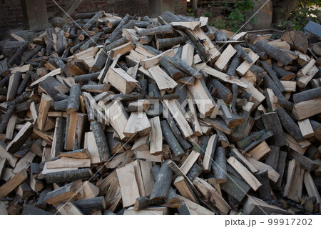 A large pile of firewood. 99917202
