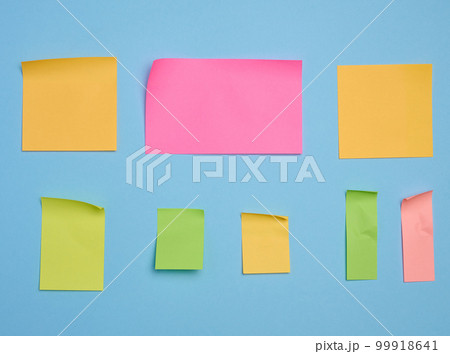 Colorful paper memo holders on blue background, space for writing data, notes Colorful paper memo holders on blue background, space for writing data, notes 99918641