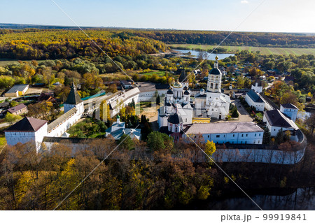 A picturesque aerial view from the side of the ponds of the ancient Orthodox Borovsko-Pafnutevsky monastery. Borovsk, Kaluga region, Russia A picturesque aerial view from the side of the ponds of the ancient Orthodox Borovsko-Pafnutevsky monastery. Borovsk, Kaluga region, Russia 99919841