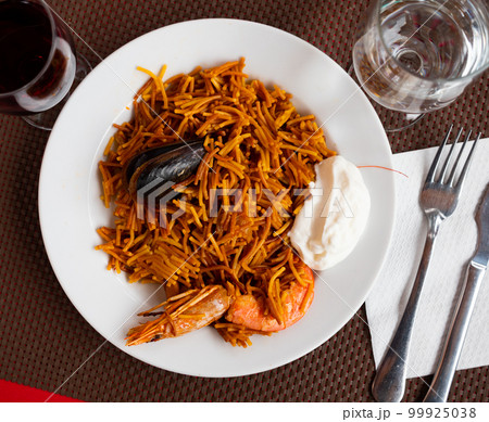 Dish of Valencian cuisine Fideua with seafood and noodles 99925038