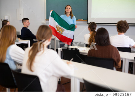 Female professor shows students flag of Iran 99925167