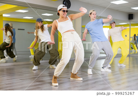 Young girl in sunglasses dancing modern dance Young girl in sunglasses dancing modern dance 99925267