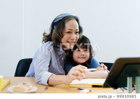 Asian portrait, grandchild granddaughter grandma grandmother and granddaughter happily join in activities to enhance skills for grandchildren. 99930985
