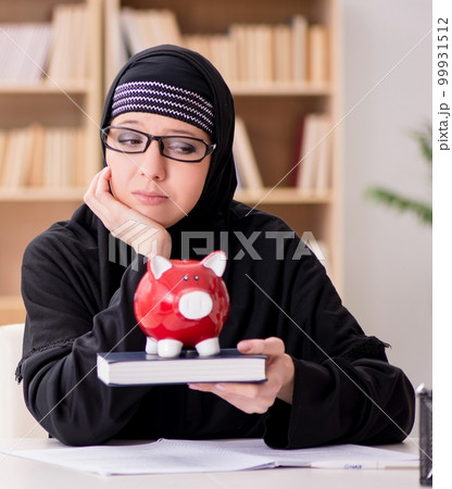 Muslim girl in hijab studying preparing for exams 99931512